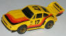 Tyco Porsche 935, yellow with orange, red, and black #17.