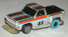Tyco Command Control slotless Chevy pickup truck in chrome with orange and light blue stripes